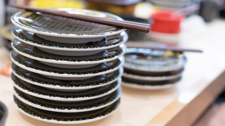 Stack of plates with chopsticks 