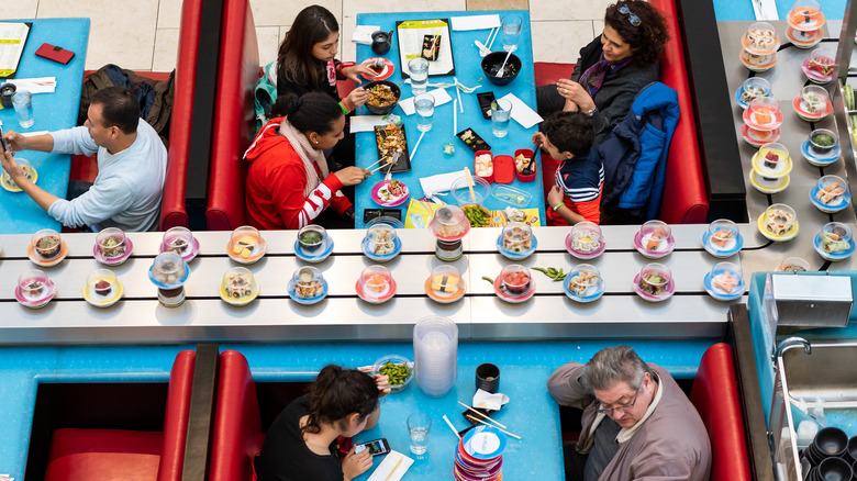 Sushi conveyor belt restaurant tables