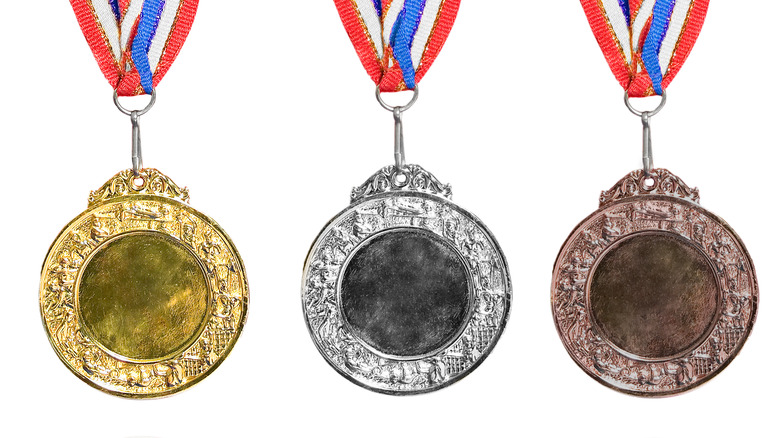 Different colored medals on white