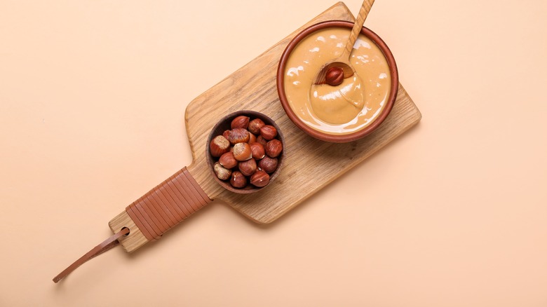 Hazelnut butter on wooden paddle