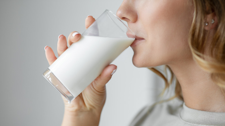 Woman drinking glass of milk