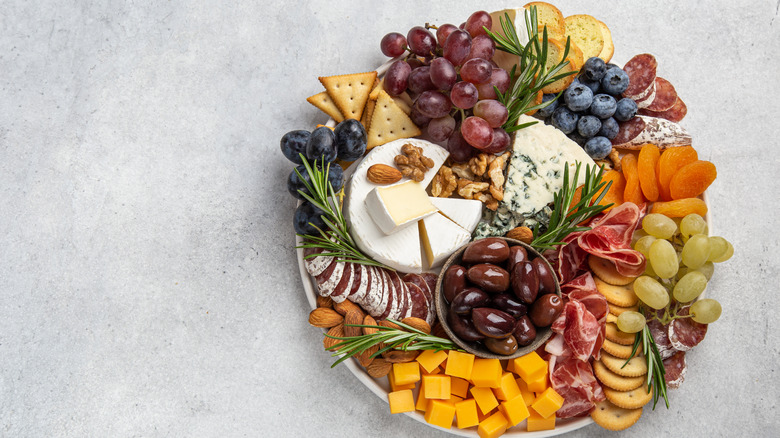 Cheese and fruit plate with crackers