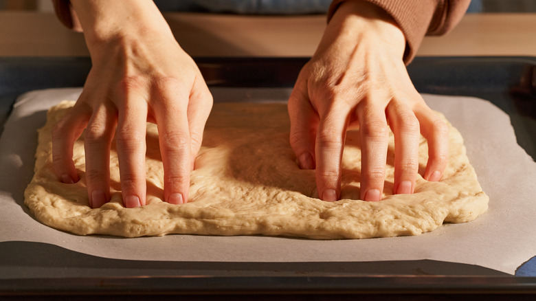 preparing pizza dough