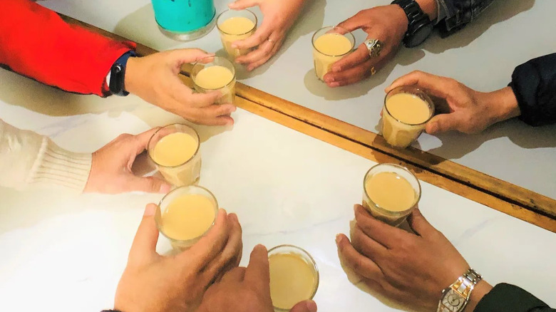 friends toasting with sweet milk tea