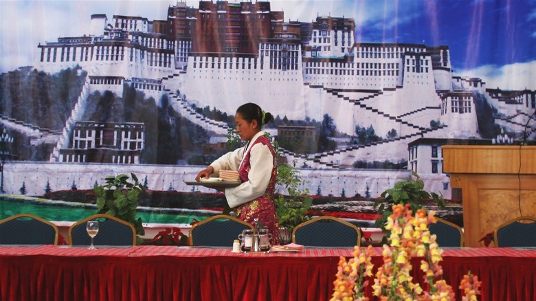 woman setting banquet table