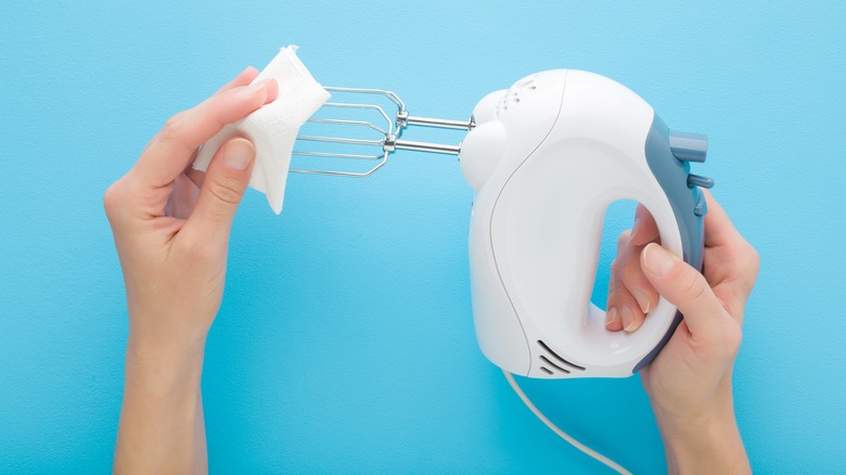 wiping a hand mixer