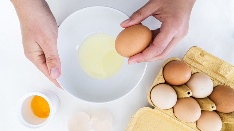 cracking eggs separating the whites