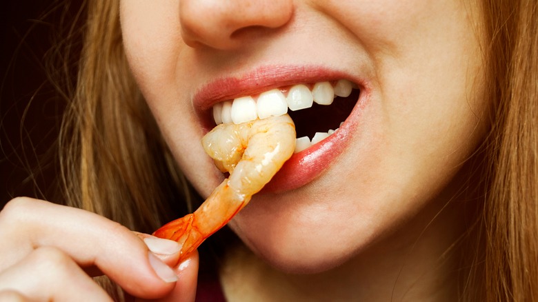 woman eating shrimp 