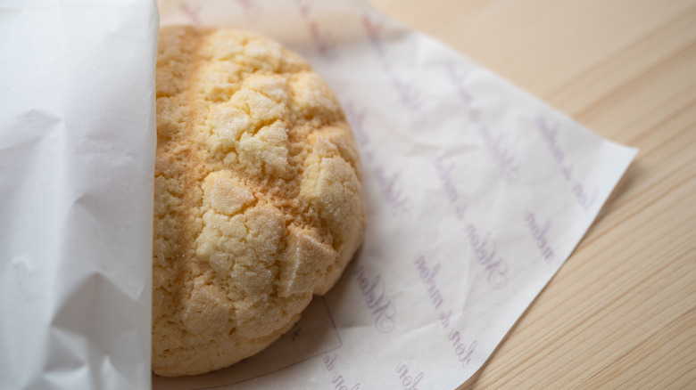 Melon bread in a paper sleeve