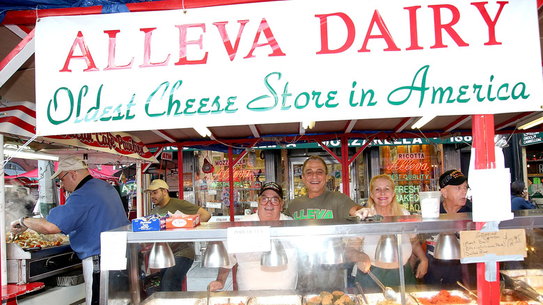 Alleva Dairy owners smiling with Tony Danza