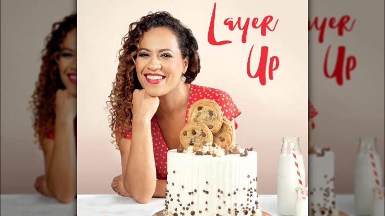 Yolanda Gampp posing with cake