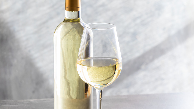 Glass and bottle of white wine