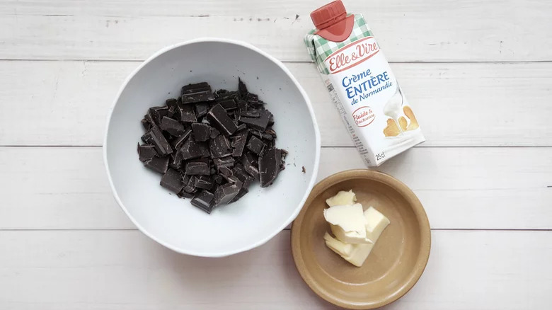 chocolate chips, butter, and cream on a table