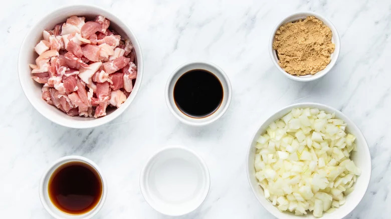 ingredients for bacon jam on a marble countertop