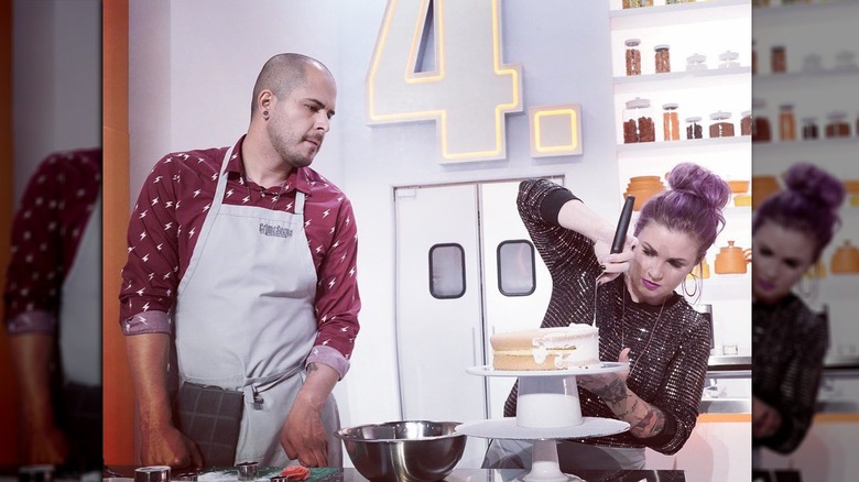 Natalie and Luis putting the final touches on a dessert