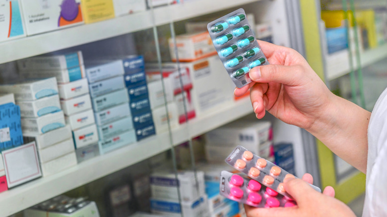 pharmacist looking at tablets