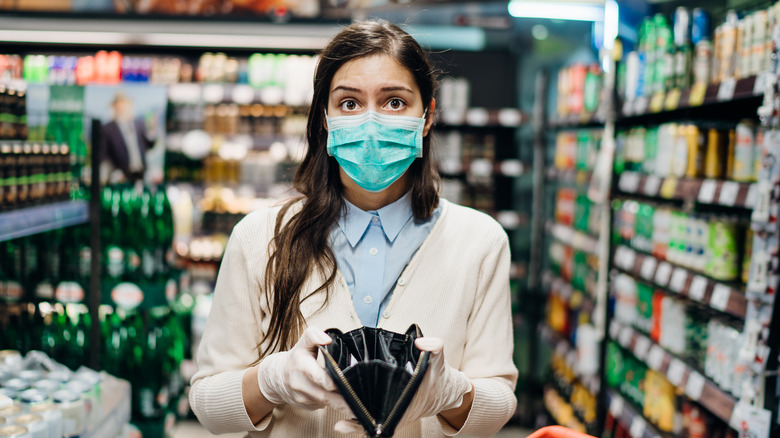 Grocery shopper with empty purse