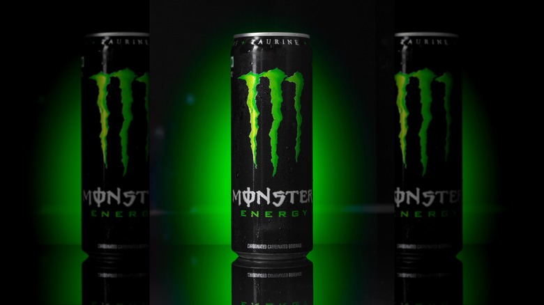 Monster Energy drink on green background