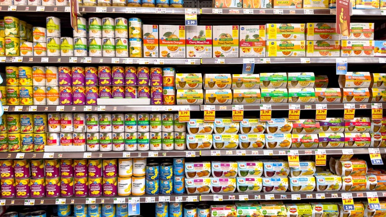 Canned fruit on grocery store shelves