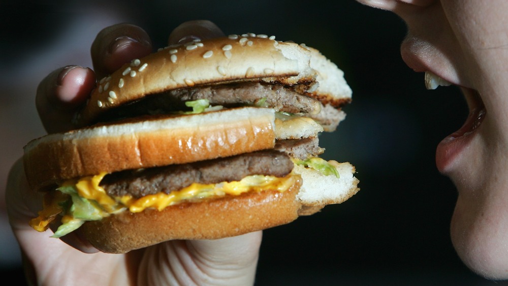 Woman eating a McDonald's Big Mac