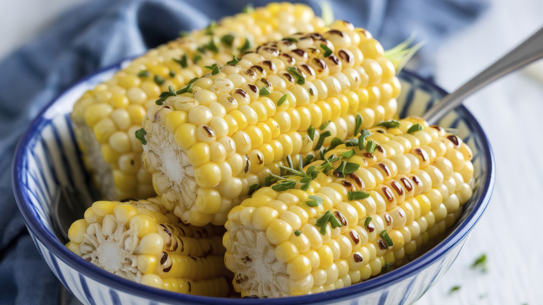 Corn on the cob with herb garnish