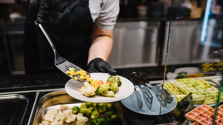 Waitstaff serving at buffet