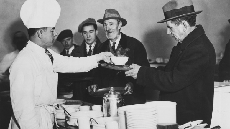 Chef serving food at a penny restaurant