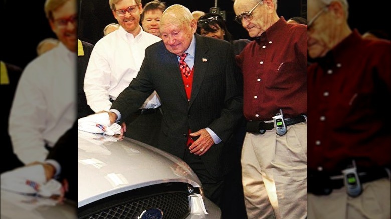 S. Truett Cathy polishes his new Ford Taurus in 2006