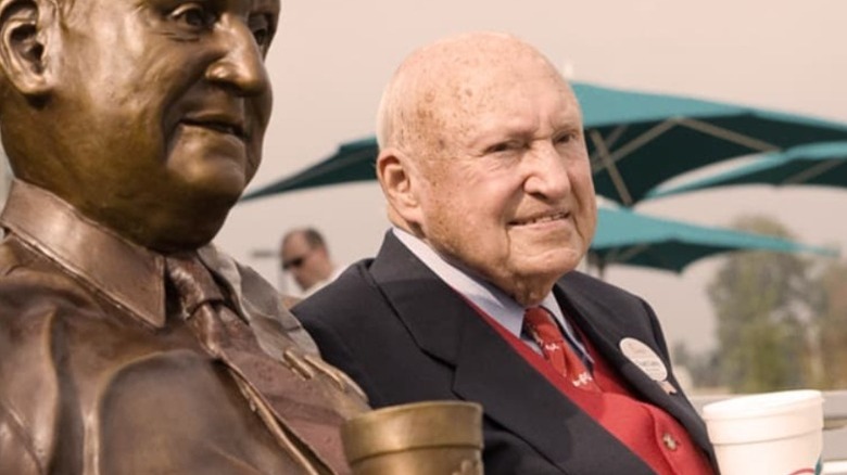 S. Truett Cathy with a statue of himself