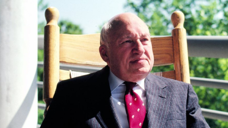 Truett Cathy in a chair on a porch