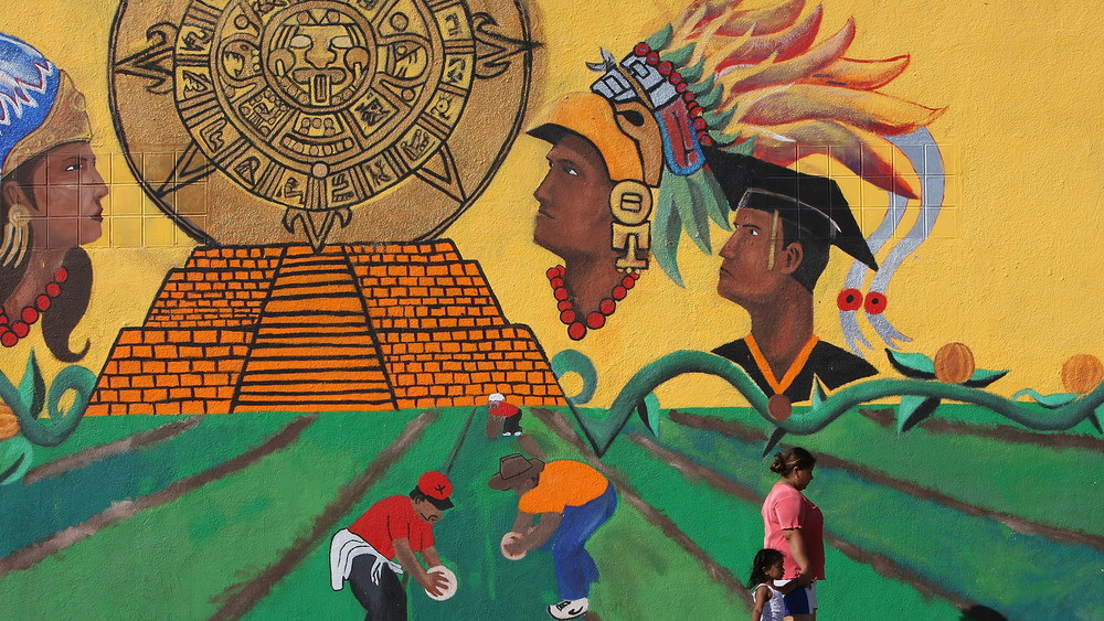 Mural depicting farming and Aztecs