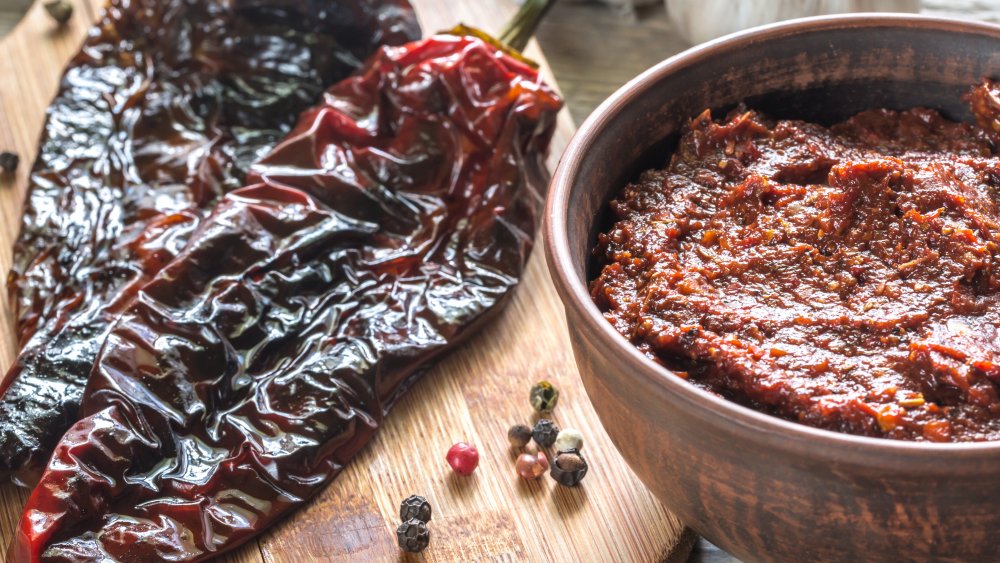 Red adobo seasoning paste with chili peppers