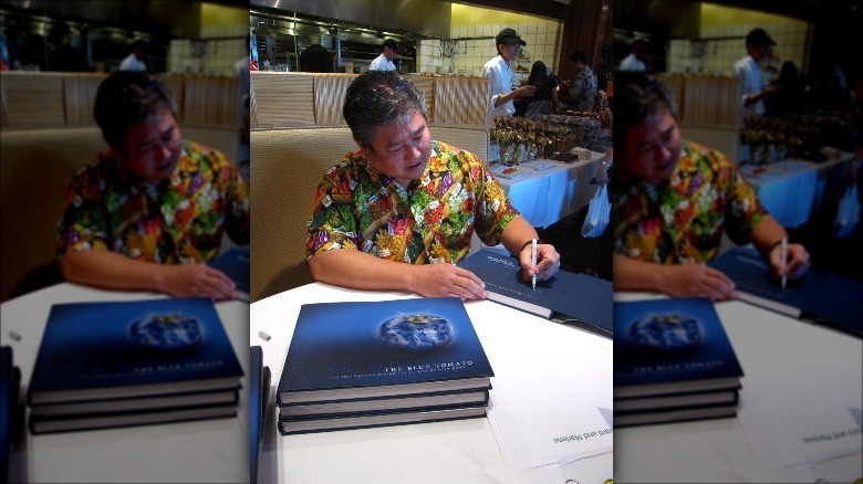 Alan Wong signing The Blue Tomato
