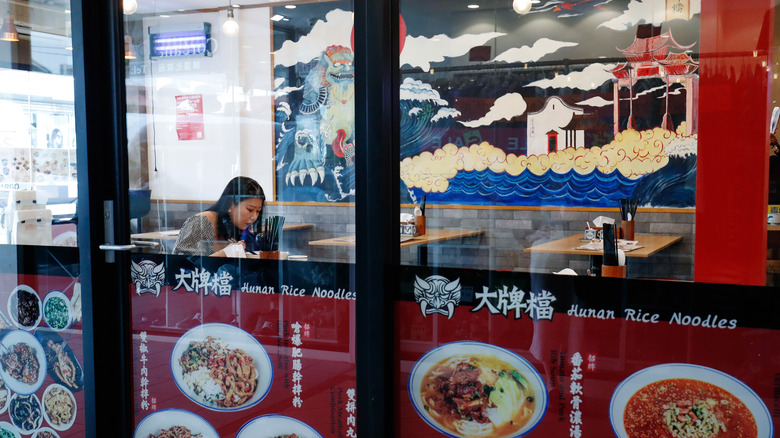 single diner eating in chinese restaurant