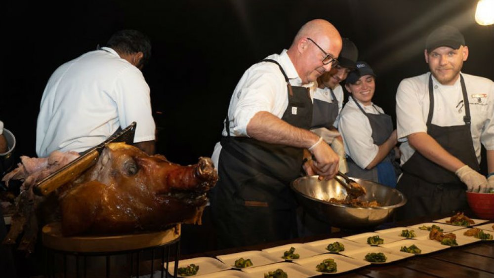 Andrew Zimmern cooking