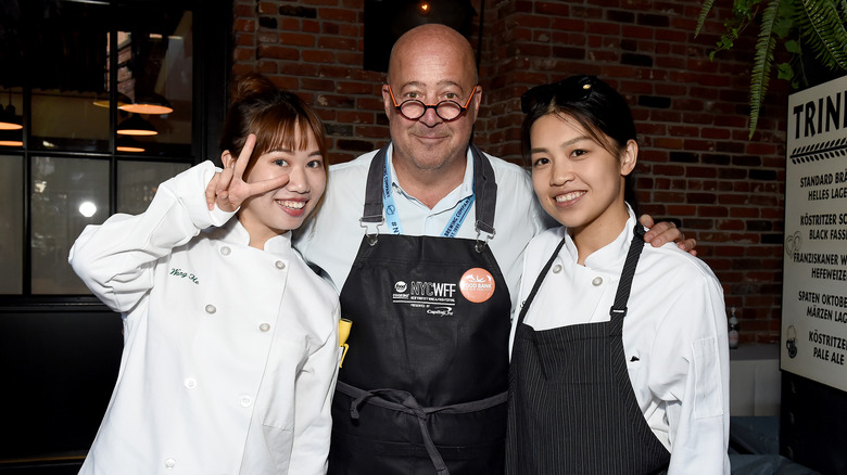 andrew zimmern with two female chefs