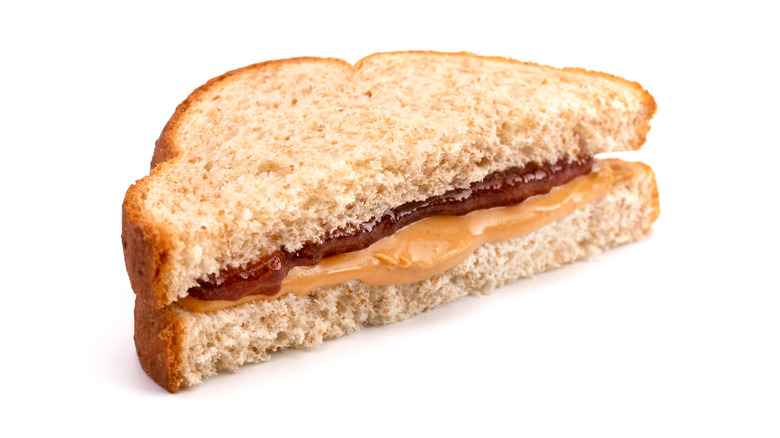 half a pb and j on white background