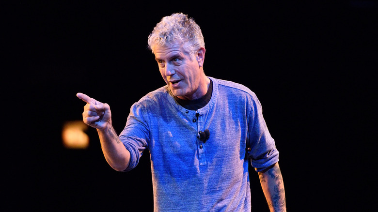 Anthony Bourdain pointing at audience