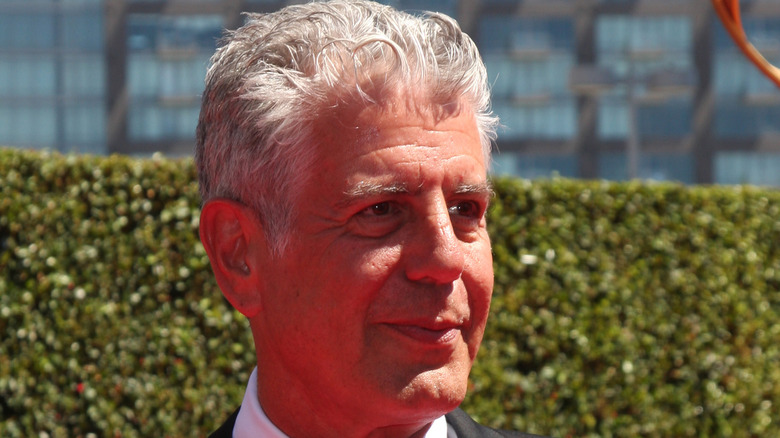 Anthony Bourdain smiling outdoors