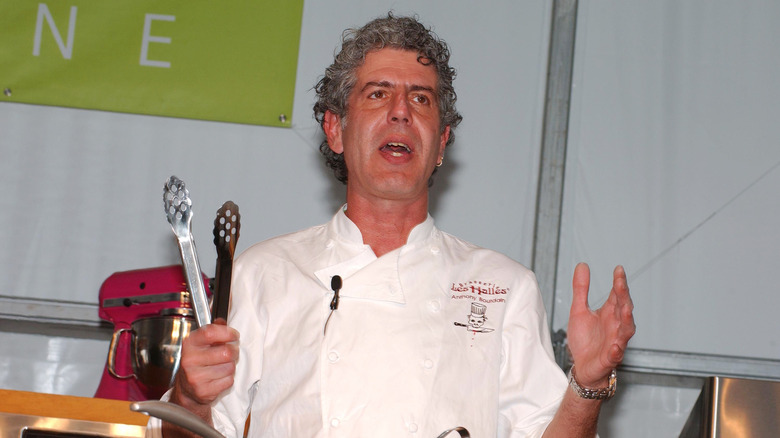 Anthony Bourdain giving cooking demonstration