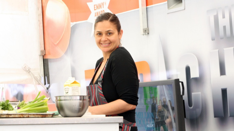 Antonia Lofaso cooking on a white table