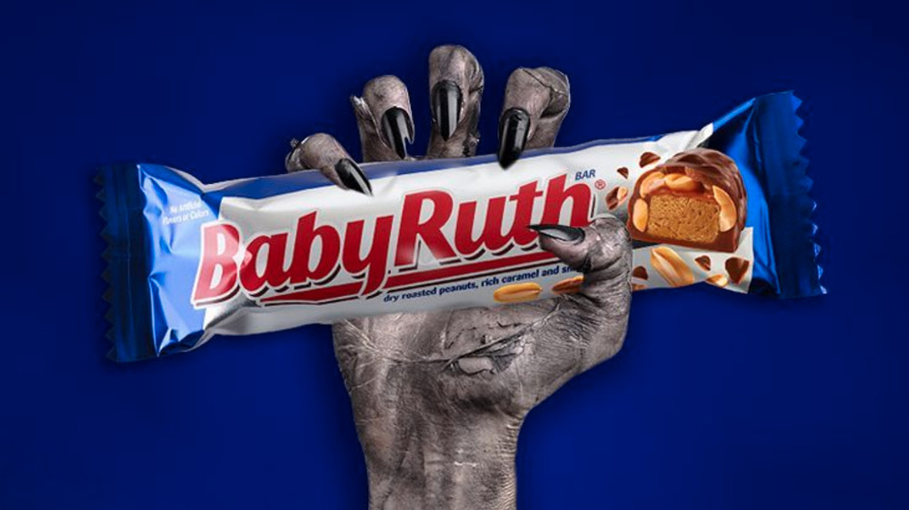 Monster hand holding Baby Ruth