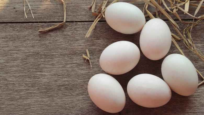 white eggs on wood floor