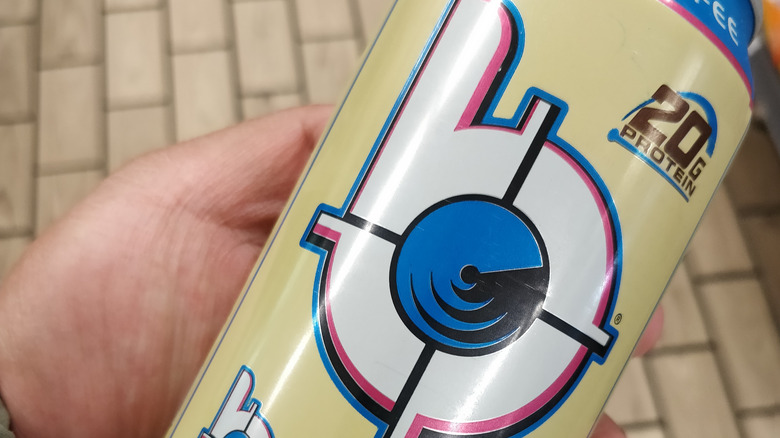 close up of a bang energy drink in someone's hand