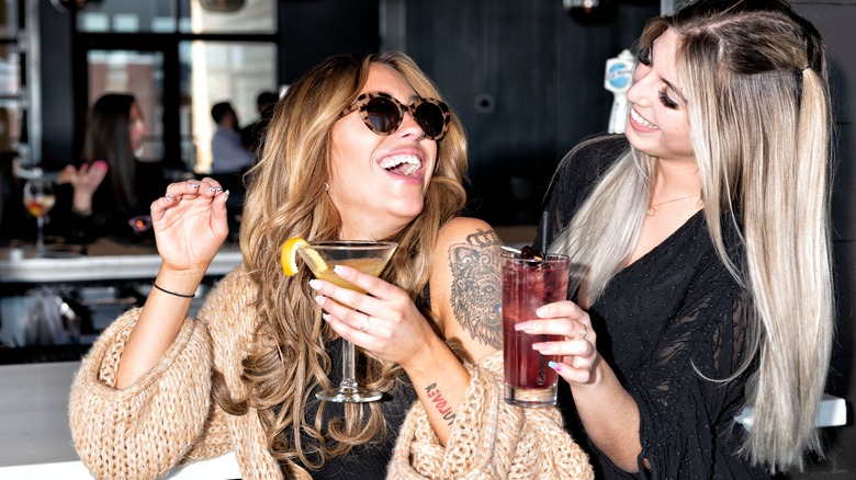 Bar Louie patrons smiling with drinks