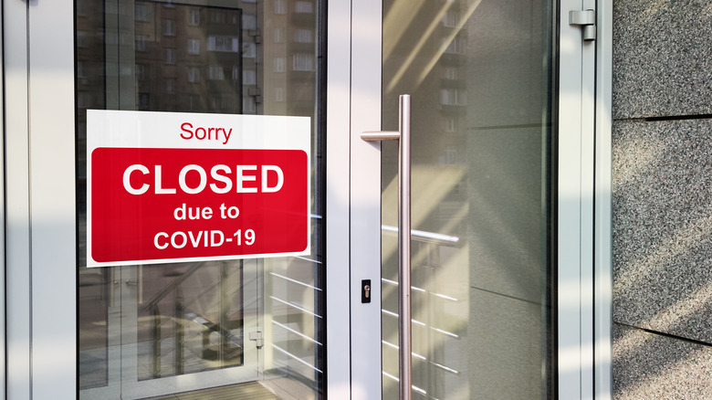 Closed COVID sign on door