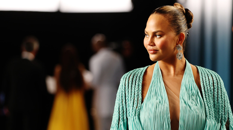 Chrissy Teigen in green dress