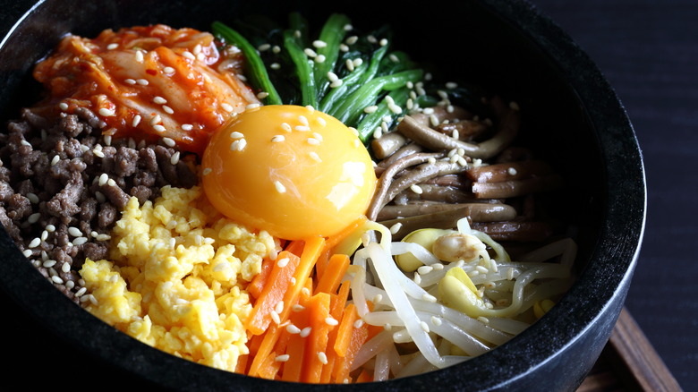 Closeup of bibimbap in stone bowl