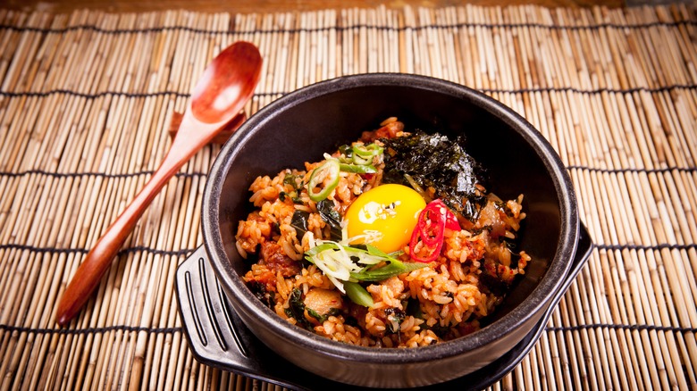 Stone pot bibimbap with a raw egg on top