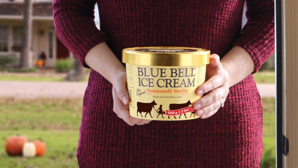 holding blue bell ice cream 